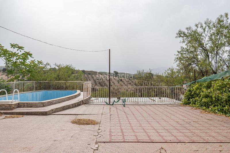 Foto e106cbe5-c6e1-4df3-acd5-9948b391f159. Chalet en camino de la barrera (far) 58 el Fargue 2000 metros de parcela segregable con chalet de 178m en tres plantas mas nave de 90 metros en Granada
