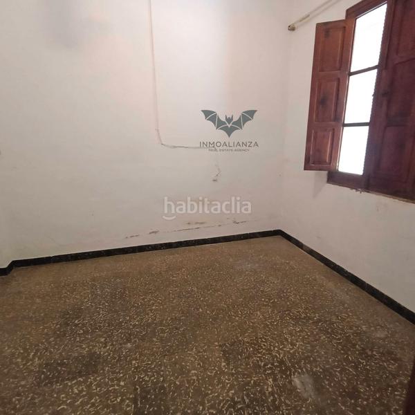 Foto 1a689cf4-c4da-44c7-a867-7bbe75550ee3. Casa adossada amb aparcament a Polinyà de Xúquer