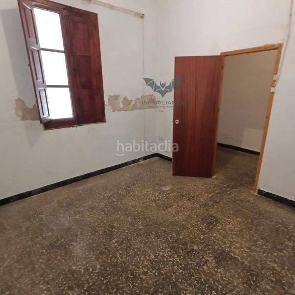 Foto 718d3003-9854-42f2-a8c0-b001254e2c58. Casa adossada amb aparcament a Polinyà de Xúquer