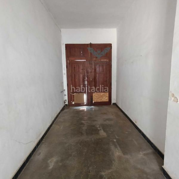 Foto 89613379-d850-4584-85b4-d00c02c4ea10. Casa adossada amb aparcament a Polinyà de Xúquer