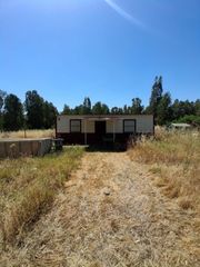 Terreny residencial a Puebla del Río (La). Terreno rústico de 1.250 m2 totalmente llano con vivienda prefab