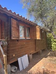 Landgut in Pilas. Parcela rustica de 1.000 m2 con casa de madera y zona de recreo