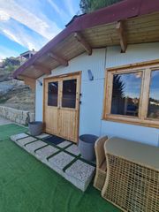 Terreny residencial a Calle cortijuela. Parcela con una casita de madera en cumbres verdes.