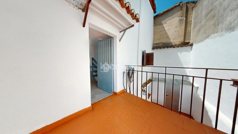 Foto f3eed613-aa9c-410f-81b3-3fd788b47e62. Casa aparellada a Torrelaguna