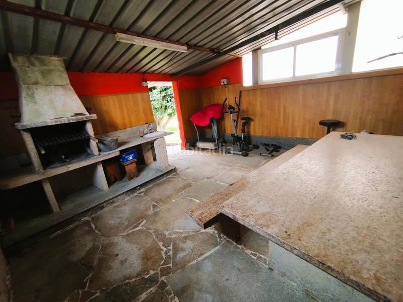 Foto 3d214040-8bba-4552-baad-ef714e0c2bd5. Chalet  de piedra con jardín en Mos