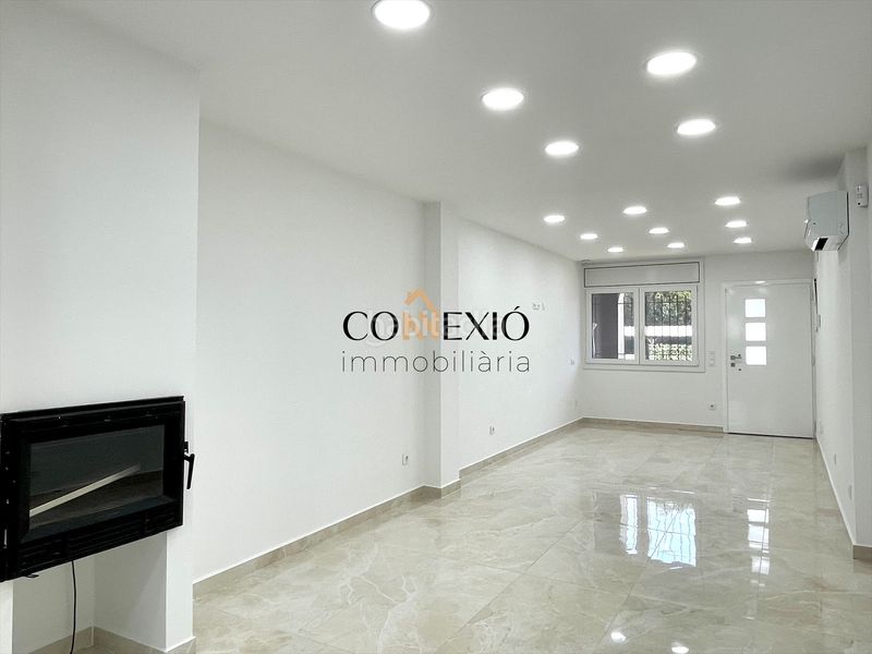 Foto 0bed60c8-54e1-486b-8536-a0faf905206f. Planta baixa amb xemeneia calefacció a Sarrià de Ter