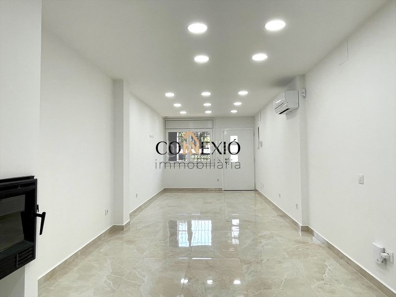 Foto 837e8134-8953-493d-a9f7-31473f9a29a4. Planta baixa amb xemeneia calefacció a Sarrià de Ter