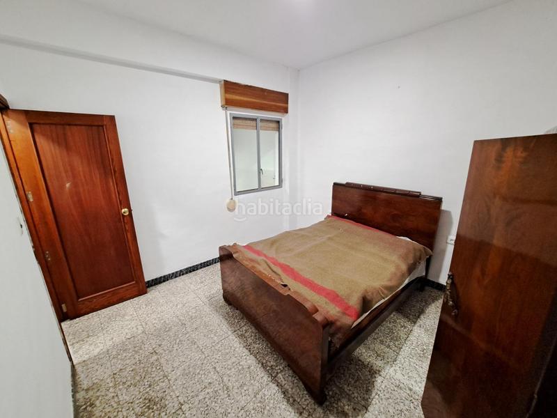 Foto 3b4e7f44-8f4f-4e4c-9bdf-9a2f2bd33b2e. Casa  en venta con dos pisos altos y bajo comercial en zona centrica en Alzira
