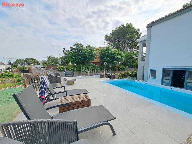 Foto b5039173-b8cf-4a69-9f4f-b34618102a17. Chalet encantador chalet en urbanización el respirall en Alzira