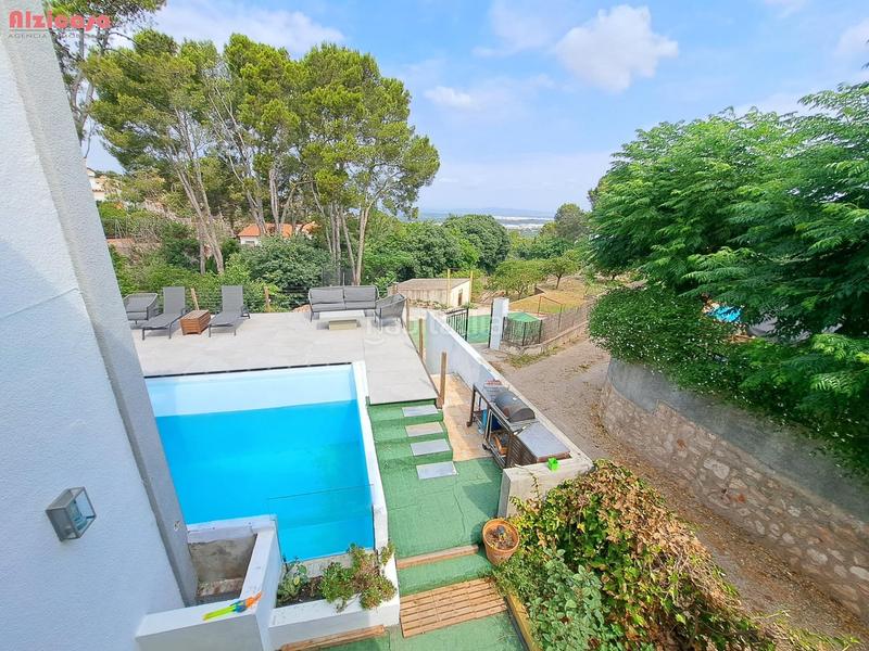 Foto 1a8339c4-71c0-4ce3-acfc-fa0b673011c4. Chalet mit parking pool in Urbanitzacions i Pedanies Nord Alzira