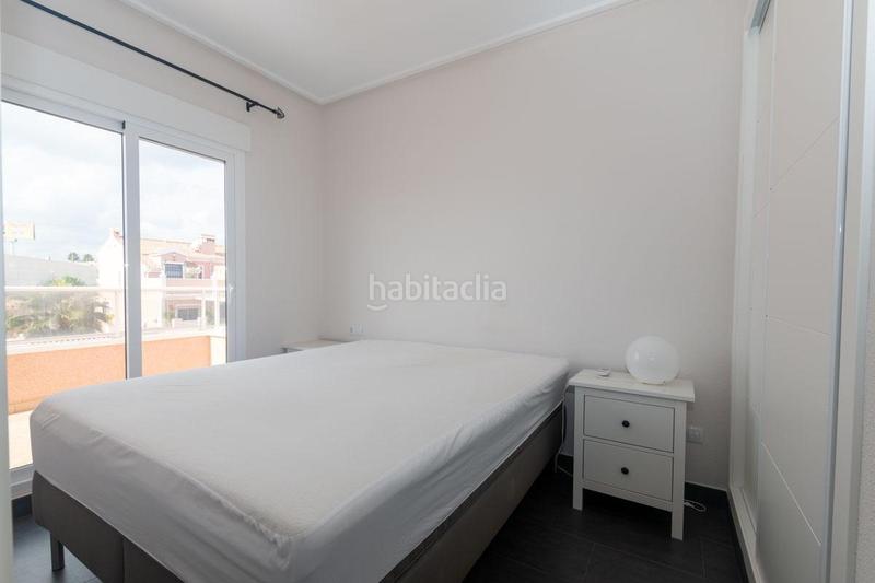 Foto 0a9eac8e-41c1-4286-bb83-e5f86e295d5a. Maison jumelée avec parking piscine dans Lomas de Cabo Roig - Los Dolses Orihuela