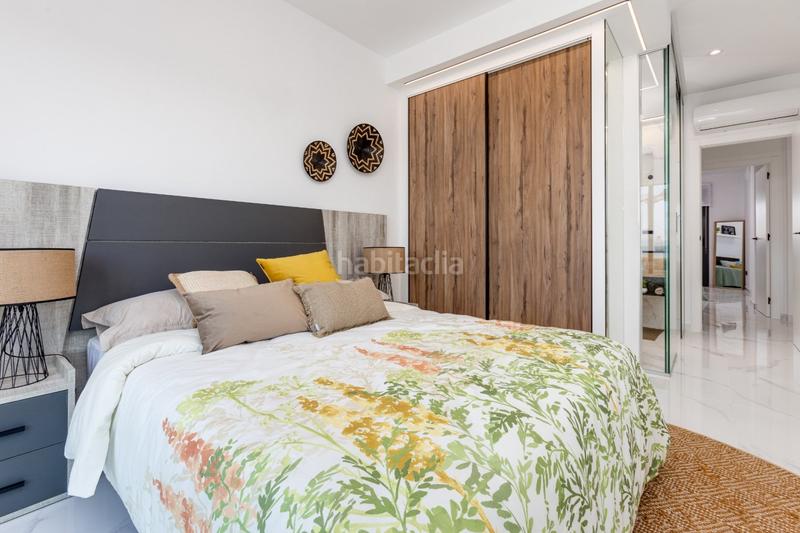 Foto d01ad374-1f26-4638-a9fa-01a6adc5d4b3. Casa pisos nuevos, de 2 o 3 dormitorios con garaje, piscina comunitaria, spa y gimnasio. en Guardamar del Segura