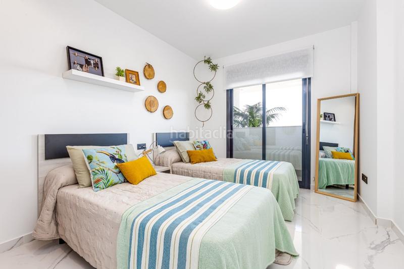 Foto e9252b37-4738-4144-8e13-21c6af4273c6. Casa pisos nuevos, de 2 o 3 dormitorios con garaje, piscina comunitaria, spa y gimnasio. en Guardamar del Segura