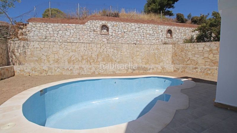 Foto 19c5e84c-838e-4f62-b9d3-d77dadc5a35d. Casa amb piscina a Torremuelle Benalmádena