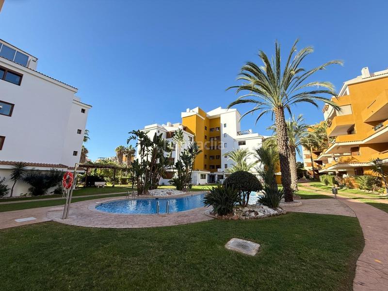 Foto 71c7c74c-35a6-47f6-ac71-e95bb8fc28fa. Apartament amb aparcament piscina a Punta Prima Torrevieja