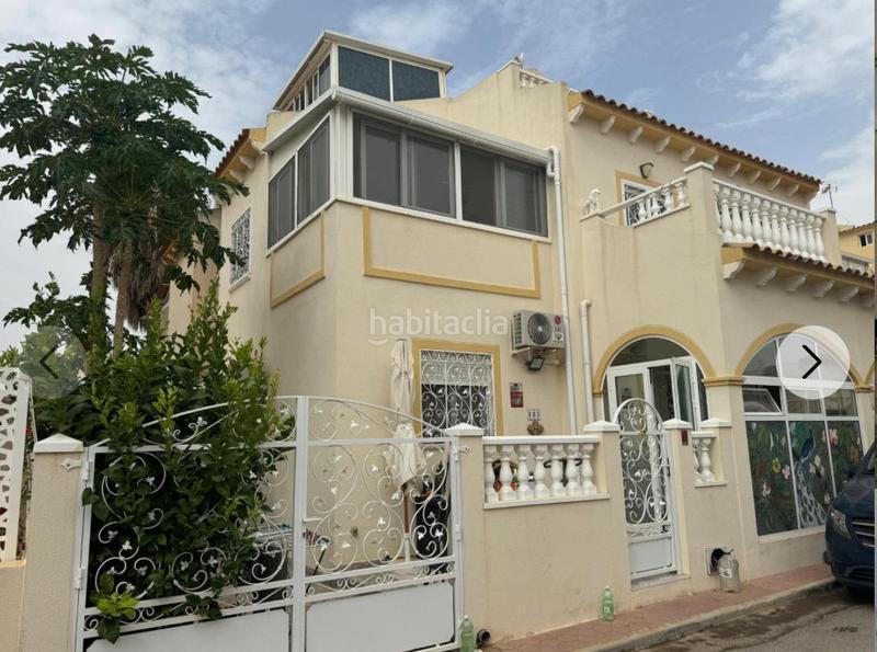 Foto 21a7386f-19ef-476d-9fc5-beea60034455. Casa aparellada amb piscina a Playa Flamenca Orihuela