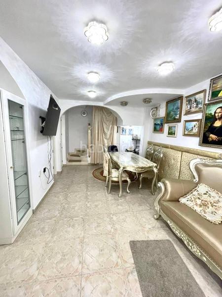 Foto 8475ae9e-a0d0-4f72-b84a-55b50fe23adc. Casa aparellada amb piscina a Playa Flamenca Orihuela