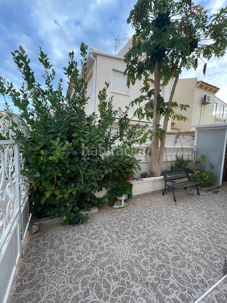 Foto cf49bd8b-d648-44aa-b573-b99627fce2c1. Casa aparellada amb piscina a Playa Flamenca Orihuela