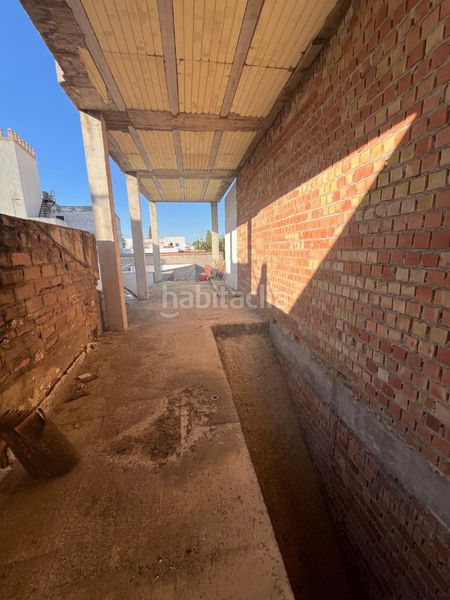 Foto 502360f9-2c99-4dc7-871a-875c9b6cf850. Casa adossada a Salteras