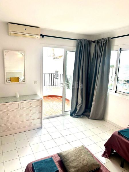 Foto 061496b5-ed83-48cd-b2b3-50d573d6dbfb. Casa amb aparcament piscina a Calahonda Mijas
