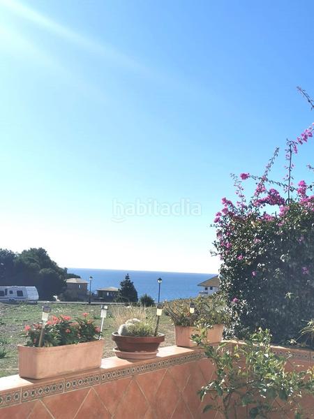 Foto 968b963d-6706-476b-9a47-db382e4f952f. Casa  adosada en la cala con vistas al mar. en Mijas