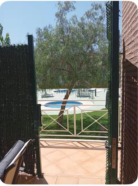 Foto 1d2c009e-5c91-4e0c-b6e5-cb51a7f7b77b. Maison jumelée avec parking piscine dans Isla Canela Ayamonte