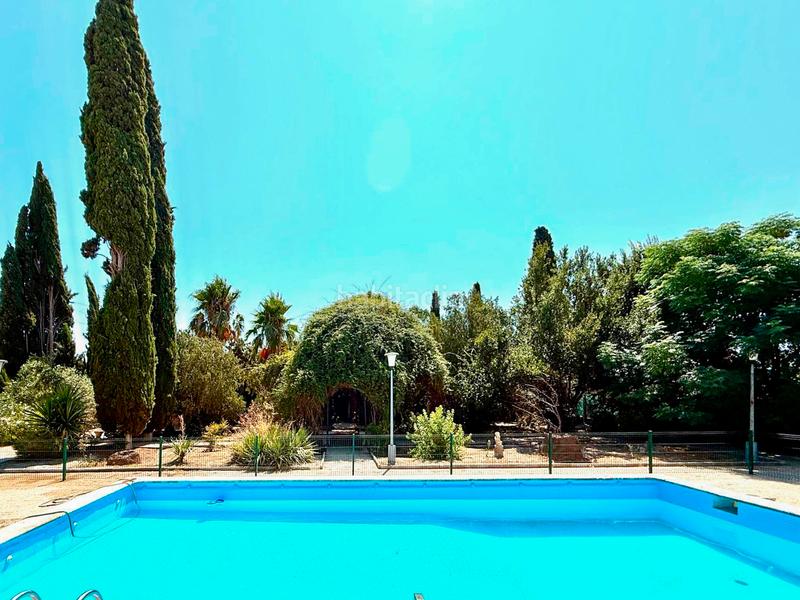 Foto 8bf0e3c7-4dd4-4a56-aff6-f81e14afcc3d. Casa en camino de Santa Fe 139 villa unica de 3000 m de parcela con casa de 360m, piscina propia, al lado del aeropuerto de granada en Santa Fe