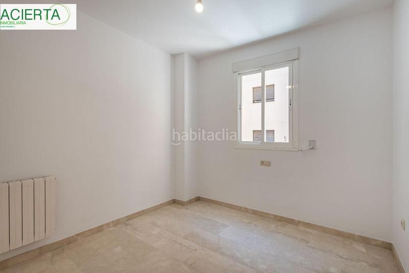 Foto 8dda1037-5295-4c95-95f3-f5f8a1b87ec0. Flat with heating parking in Rosaleda - Juventud Granada