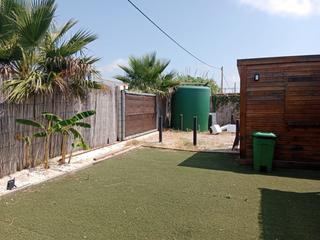 Casa a El Palmar. Parcela con casa de madera en el palmar