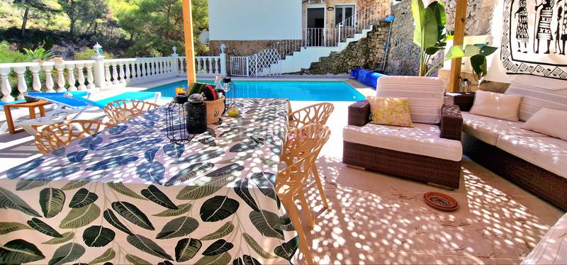 Foto 4e67df6b-67b7-4280-a1a8-0d4fc80385ce. Casa encantadora villa renovada en una zona verde cerca de la playa de baladrar en Benissa