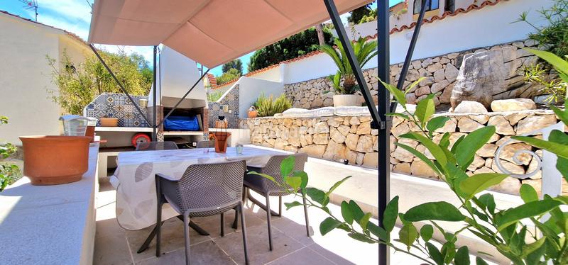 Foto f3ff9681-b535-442f-8445-0252cc3df7fd. Casa encantadora villa renovada en una zona verde cerca de la playa de baladrar en Benissa