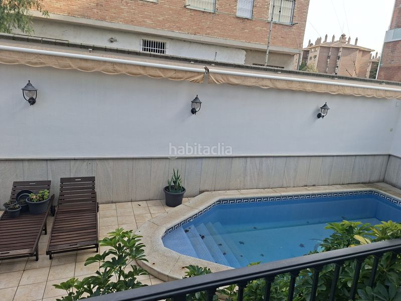Foto 722b10a3-5f21-440c-bead-7bfccd348bc8. Casa aparellada amb xemeneia calefacció aparcament piscina a Granada