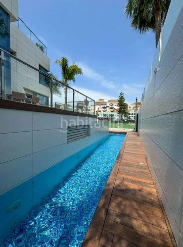Foto 4c05ea62-5689-45b4-a32d-24be5dd84270. Chalet avec parking piscine dans Playa de Granada Motril