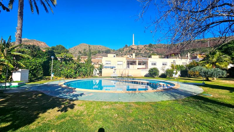 Foto 8da8b92a-db7c-4af7-9443-7de2baa5ac91. Casa adossada amb aparcament piscina a Portmán Unión (La)