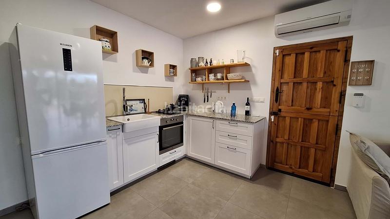 Foto c9edeeac-d6ed-4db7-828e-938fc9a67621. Casa amb aparcament a Oliva nova Oliva