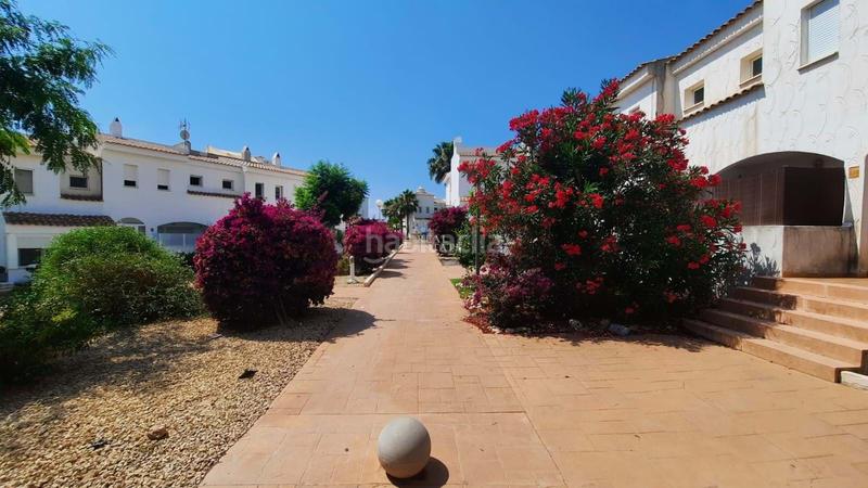 Foto 0c29cb21-88d1-47c8-bf73-50cfb92cf5e6. Casa adosada la propiedad cuenta con un diseño luminoso de planta abierta en la planta baja, que combina una cocina moderna, un cómodo salón y en Nucia (la)