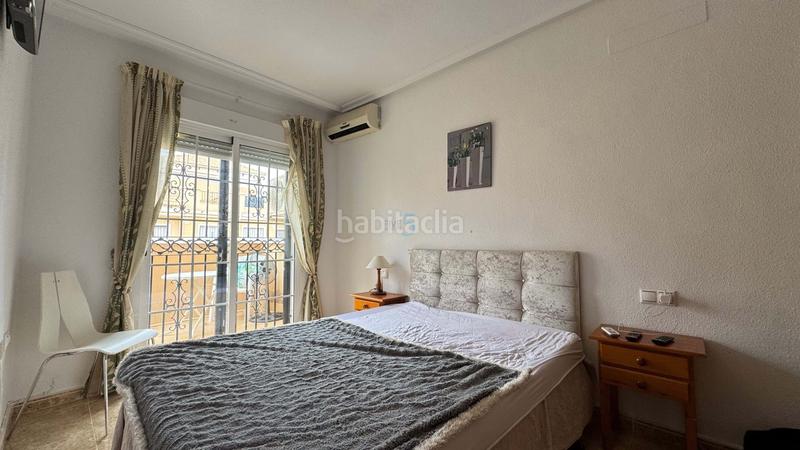 Foto 5a8c0fb1-b72a-44ee-a70a-40047e61cec6. Casa adosada encantadora casa adosada de 3 dormitorios y 2 baños en villamartín, con piscina comunitaria, solárium y camino de entrada. la prop en Orihuela