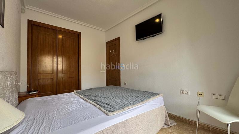 Foto 7b06c7a4-061a-42ce-93b8-3eada59f30cf. Casa adosada encantadora casa adosada de 3 dormitorios y 2 baños en villamartín, con piscina comunitaria, solárium y camino de entrada. la prop en Orihuela