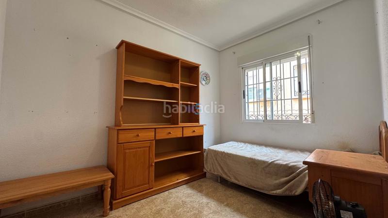 Foto d6b40ef6-cfb1-47e5-a979-ef9cae90d46e. Casa adosada encantadora casa adosada de 3 dormitorios y 2 baños en villamartín, con piscina comunitaria, solárium y camino de entrada. la prop en Orihuela