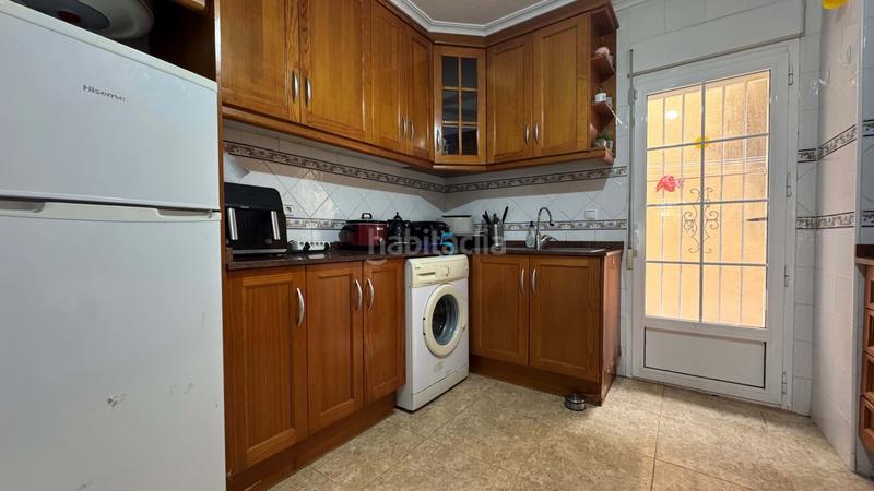 Foto fd631468-ee0f-45d2-bde9-41d1abf9e491. Casa adosada encantadora casa adosada de 3 dormitorios y 2 baños en villamartín, con piscina comunitaria, solárium y camino de entrada. la prop en Orihuela