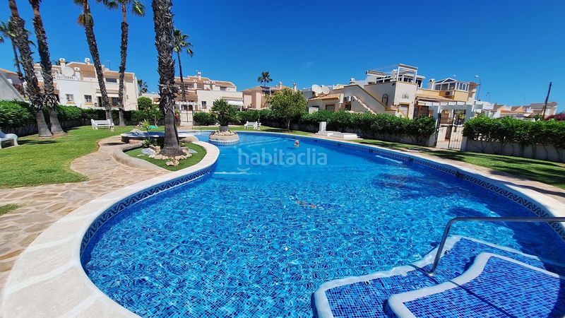 Foto ab06df6e-bf04-4f45-bf04-0875b2944eac. Casa amb aparcament piscina a Playa Flamenca Orihuela
