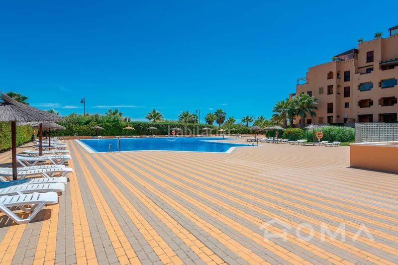 Foto c737a15f-31f1-4f36-bbb4-64c130e1b7b2. Apartament amb calefacció aparcament piscina a Isla Canela Ayamonte