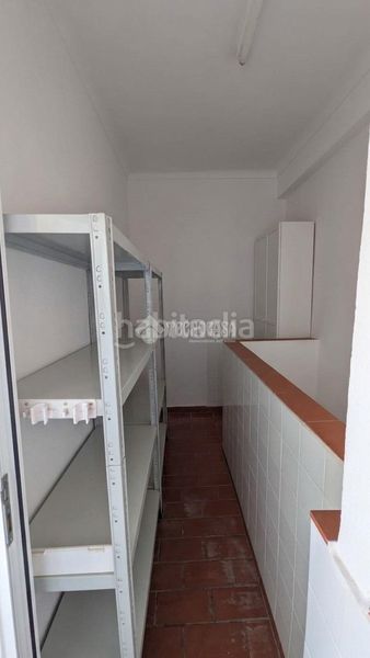 Foto b2c15030-c13e-48dc-ad7a-a36c6e83630c. Casa aparellada a Marchena
