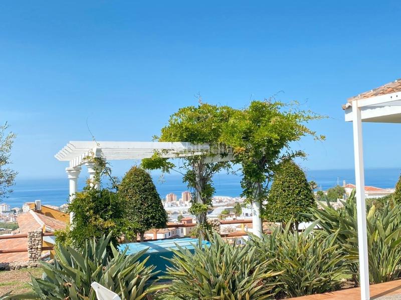 Foto 1a52129c-7a39-4b7a-9b88-ecc85b454397. Chalet with fireplace heating parking pool in Urbanización Santa Rosa Torrox