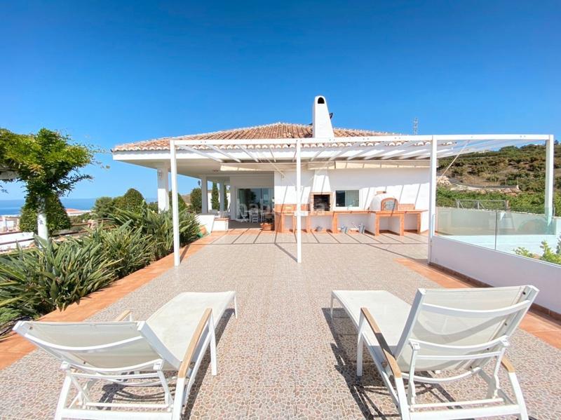 Foto 6f753706-4472-46f9-8e22-2aa273d792c1. Chalet with fireplace heating parking pool in Urbanización Santa Rosa Torrox