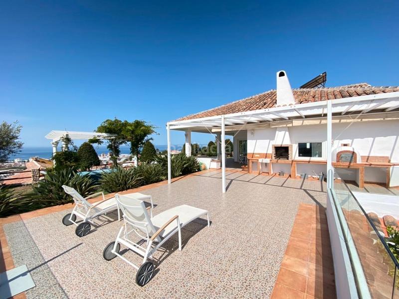 Foto ad071571-59e2-4539-9b5e-35ba2f48c959. Chalet with fireplace heating parking pool in Urbanización Santa Rosa Torrox