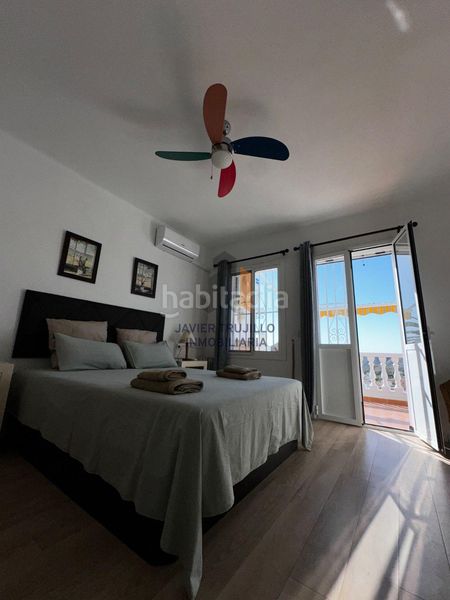 Foto 99c6c21c-2050-4153-a0b6-c8bdd2167843. Casa adossada amb aparcament piscina a Avda Pescia - Ctra de Frigiliana Nerja