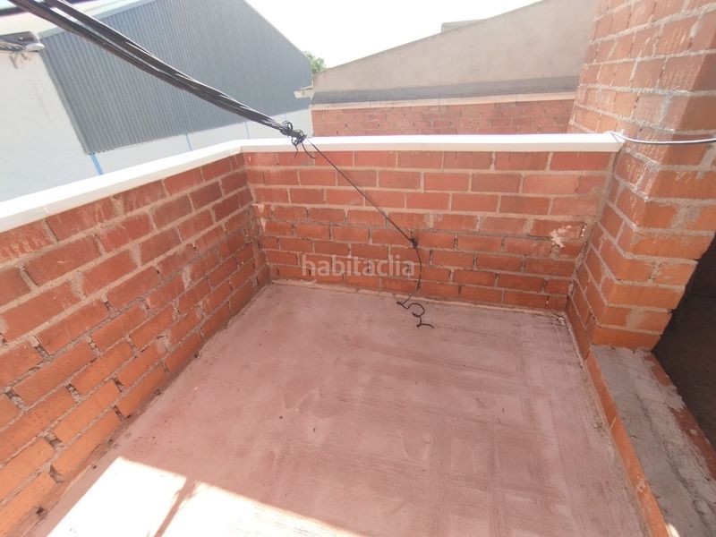 Foto 06d5e61b-1a8d-41f7-804a-74cc70fd1416. Casa adossada amb aparcament a Tomelloso