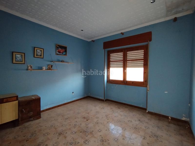 Foto 287c5026-ee95-4ed2-b0f3-f4d19c774989. Casa aparellada a Tomelloso