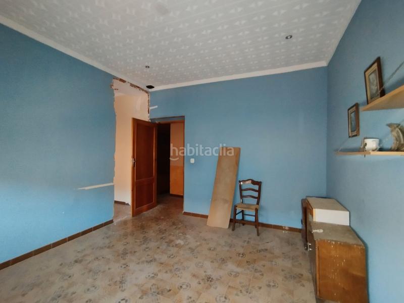 Foto 874d6f0b-53c4-46de-b8f5-1a234d74827f. Casa aparellada a Tomelloso